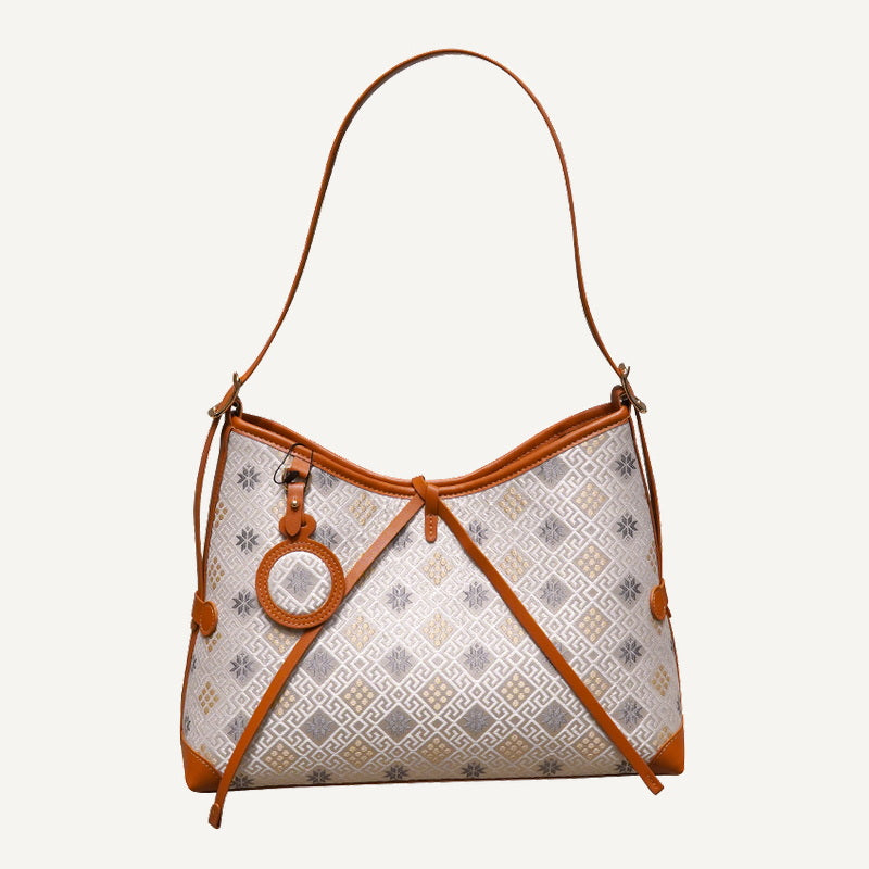 Gray white octagonal star chrysanthemum brocade-inspired drawstring shoulder bag front view on warm neutral background