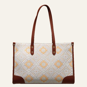 Four Swallows brocade-inspired work tote on warm neutral background