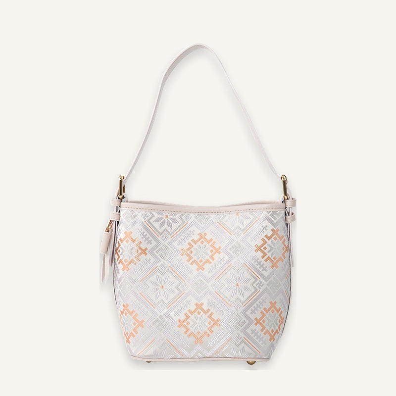 Ivory Four Swallows brocade-inspired bucket bag front view