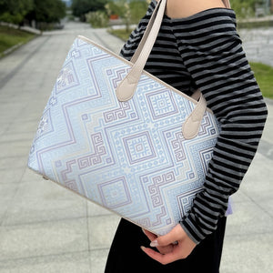 Model carrying multicolor brocade shoulder bag