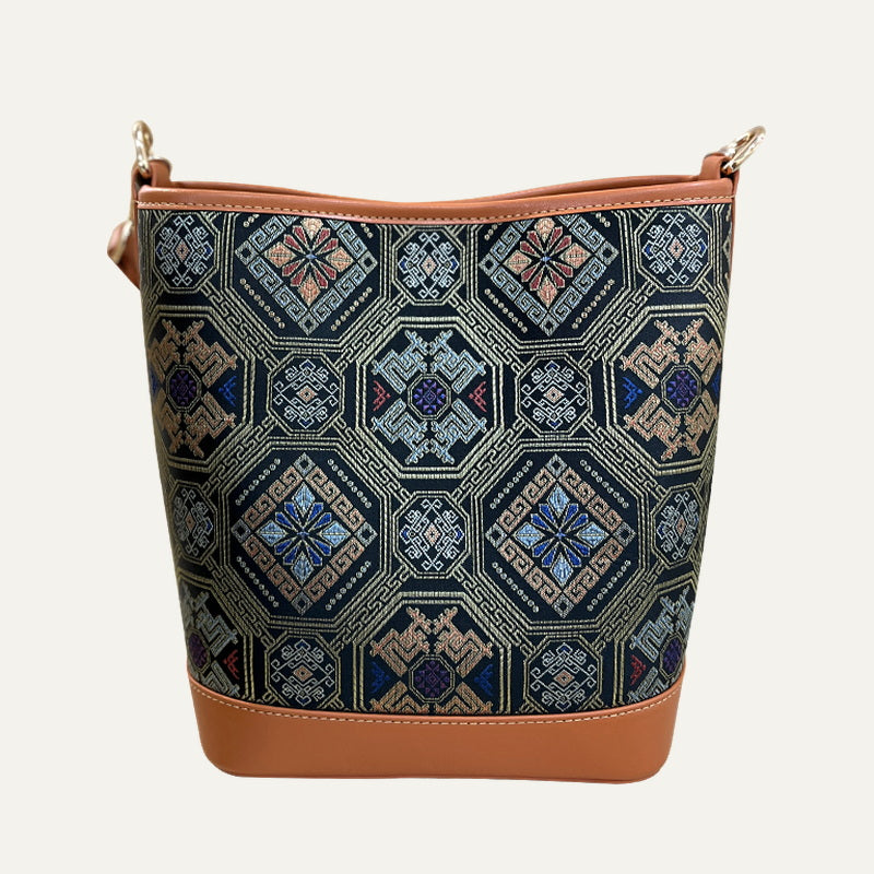 Phoenix Butterfly brocade-inspired bucket bag front view on soft neutral background