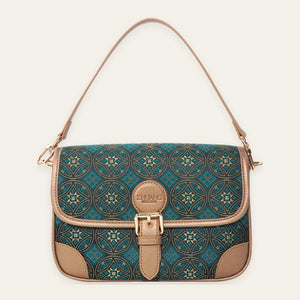 Deep teal Flying Swallow brocade-inspired baguette bag front view on warm neutral background