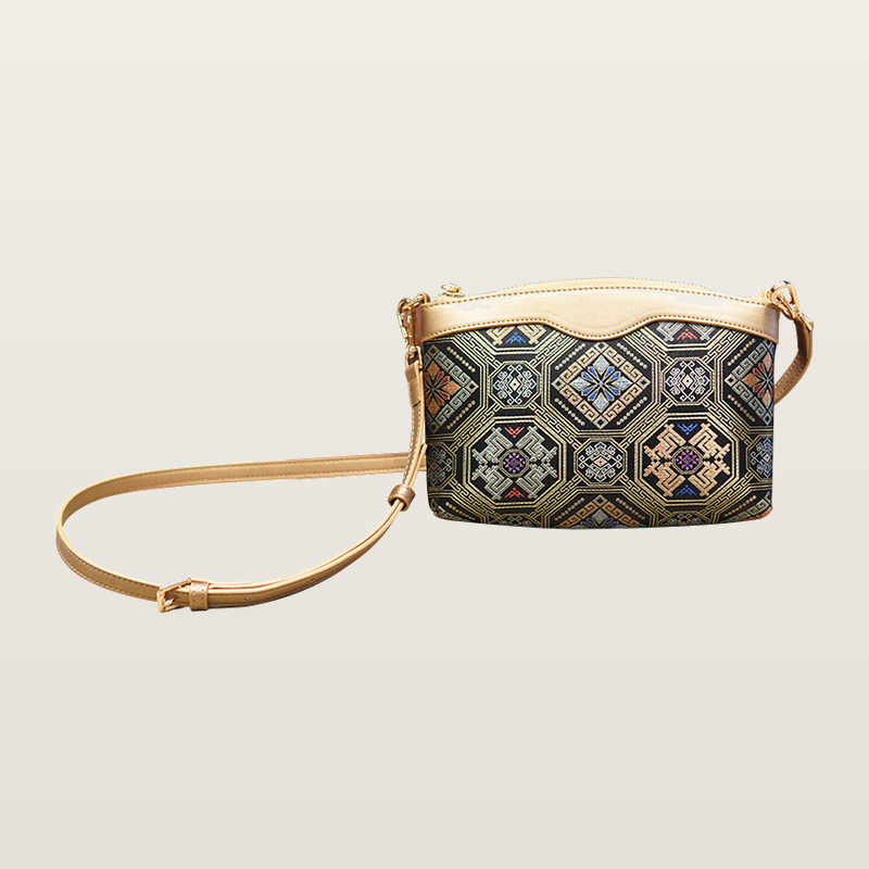 Phoenix butterfly brocade-inspired phone crossbody bag on warm neutral background