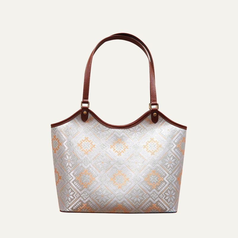 Soft white Four Swallows brocade-inspired market tote bag front view on soft neutral background