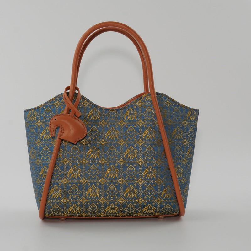 Royal blue Wanxiang Wave brocade-inspired shoulder bag front hero view