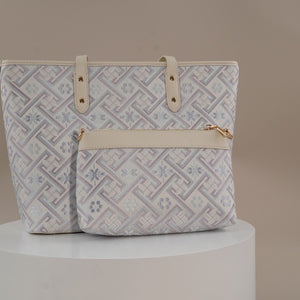 Silver purple Zhuang brocade bag set in indoor display setting