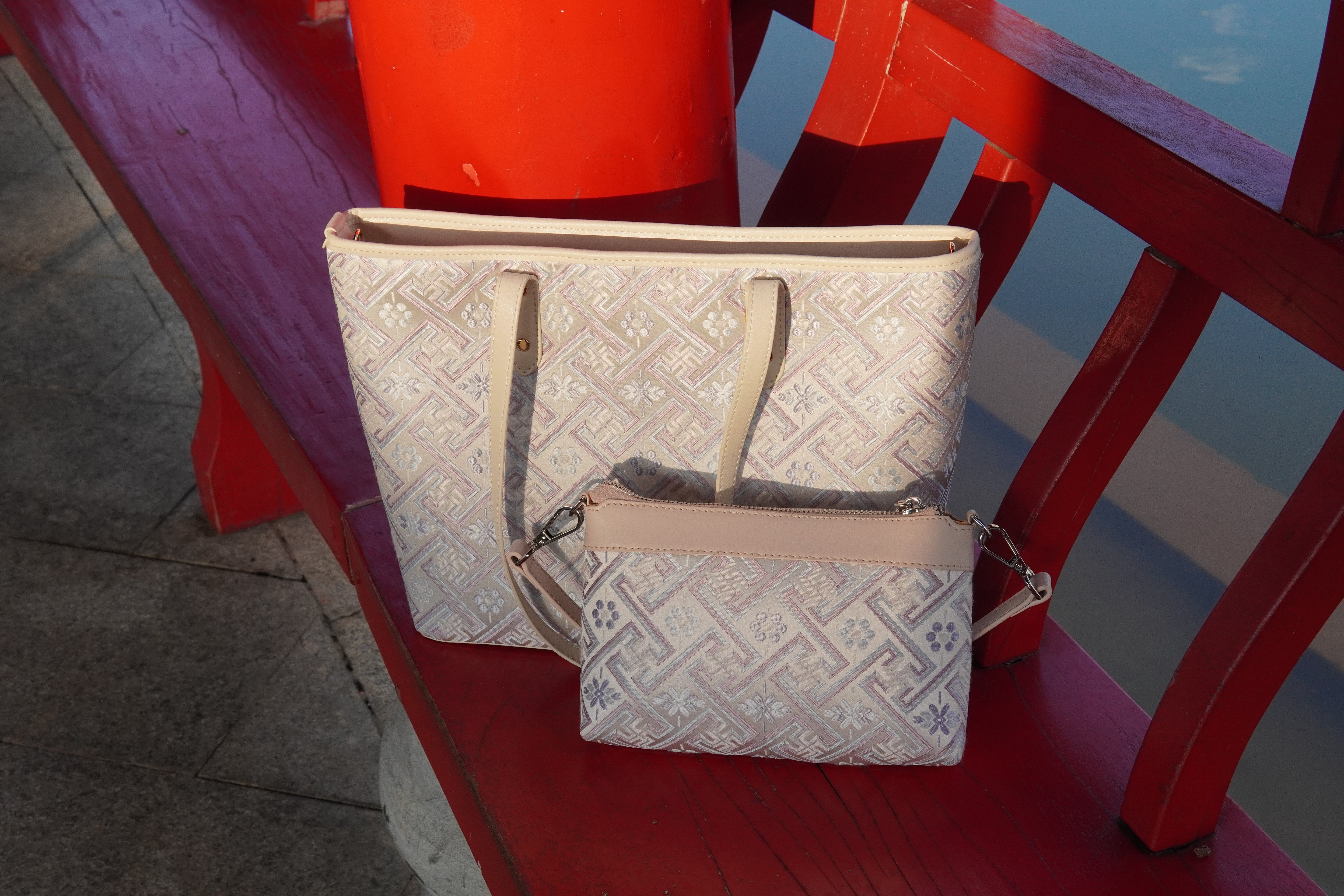 Silver purple Zhuang brocade tote in a lifestyle setting