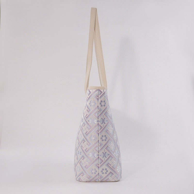 Side profile of the silver purple Wanjie Zhuang brocade tote