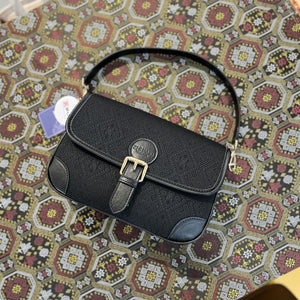 Black brocade baguette bag detail