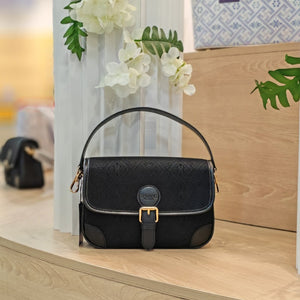 Black brocade baguette bag detail