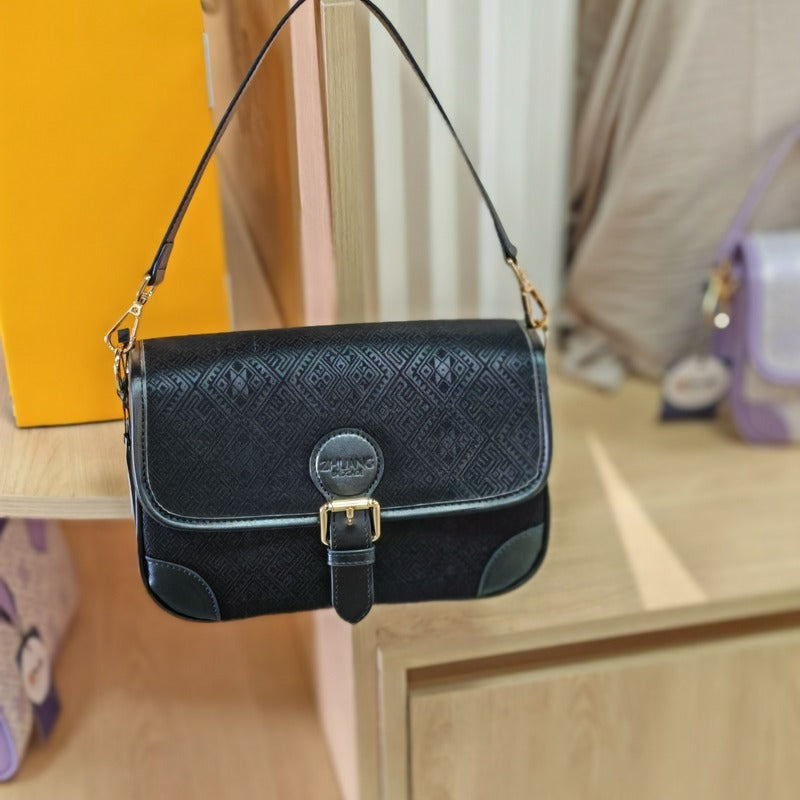 Black brocade baguette bag detail