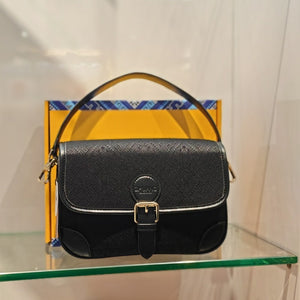 Black brocade baguette bag detail