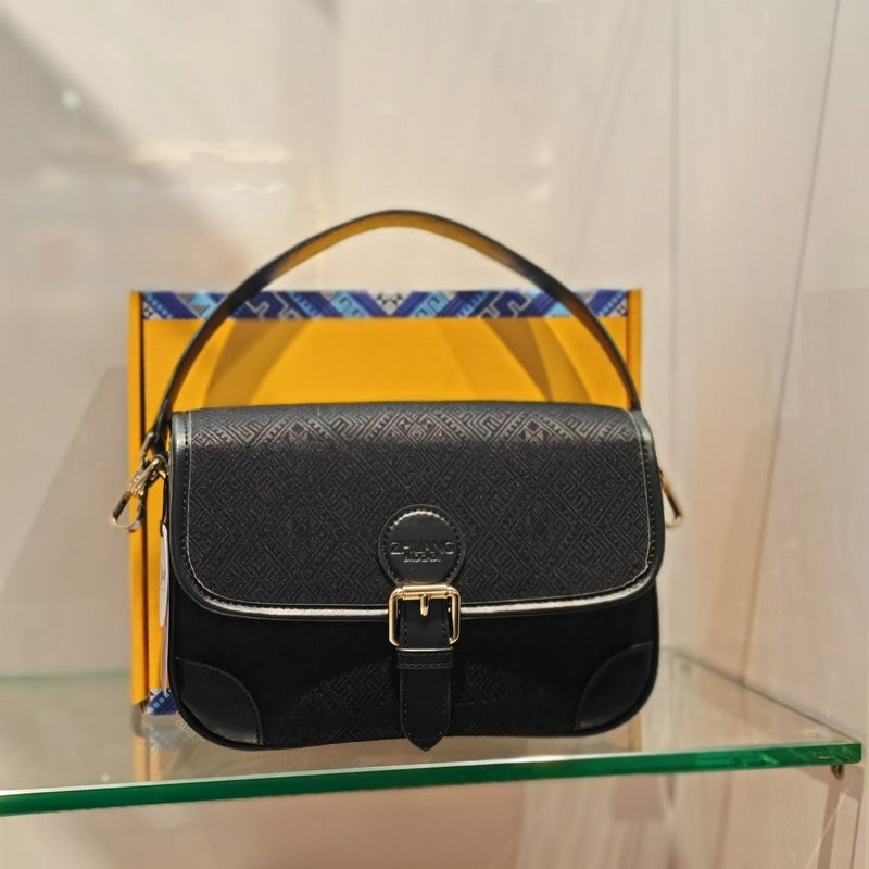Black brocade baguette bag detail