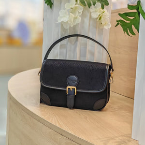 Black brocade baguette bag detail
