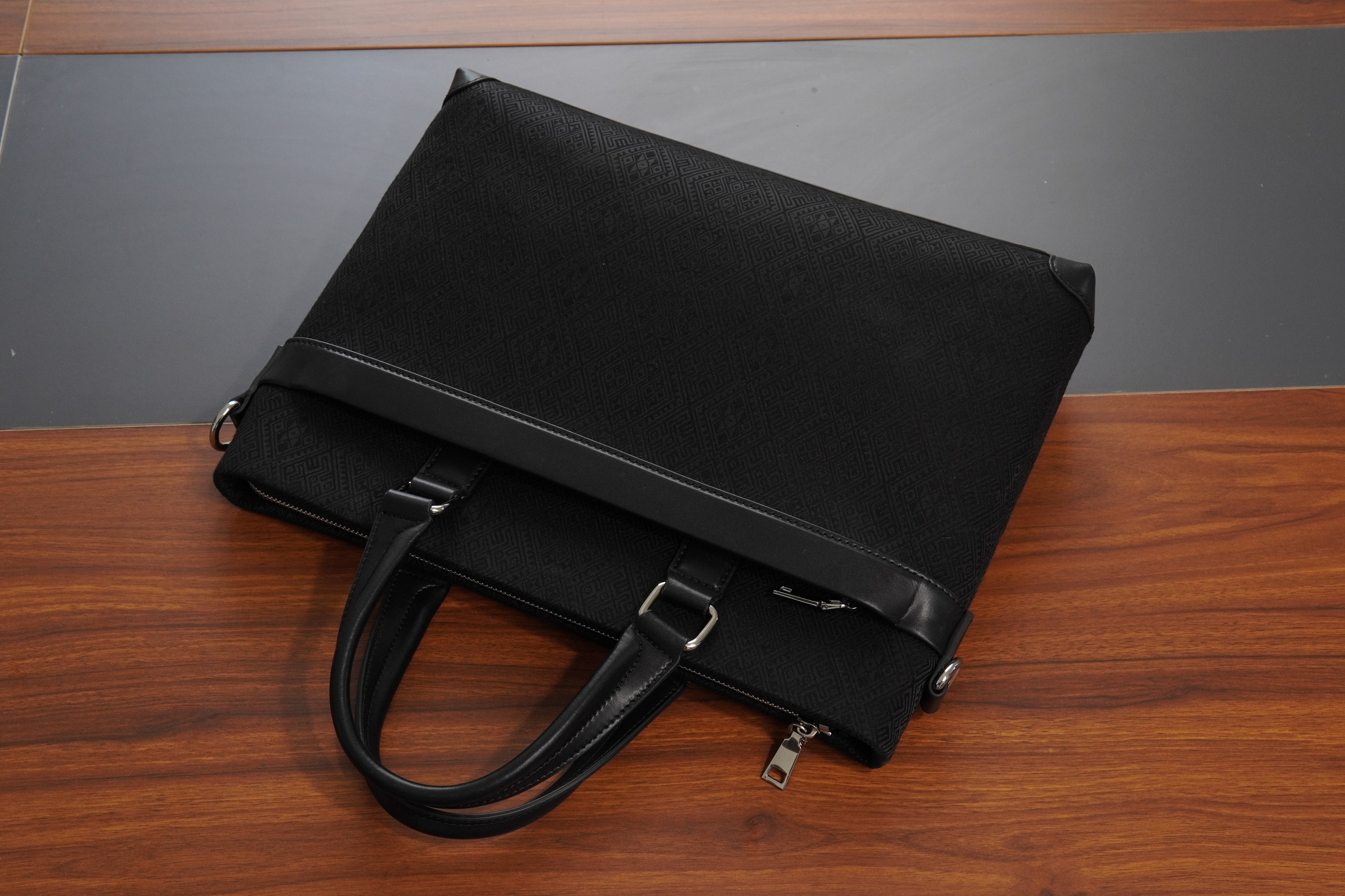 Black brocade briefcase in lifestyle scene