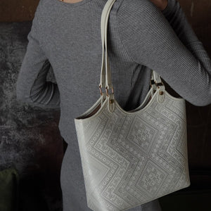 Ivory White brocade tote bag in lifestyle scene