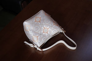 Multicolor brocade bucket bag in lifestyle scene