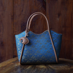 Multicolor brocade shoulder bag in lifestyle scene