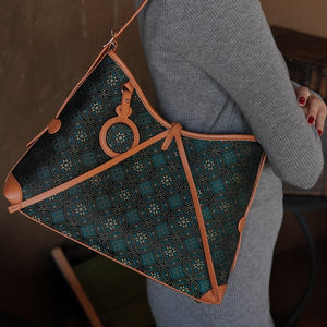 Model carrying multicolor brocade shoulder bag