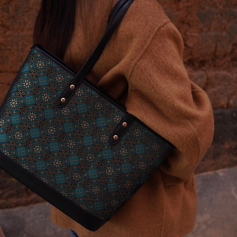 Model carrying multicolor brocade tote bag